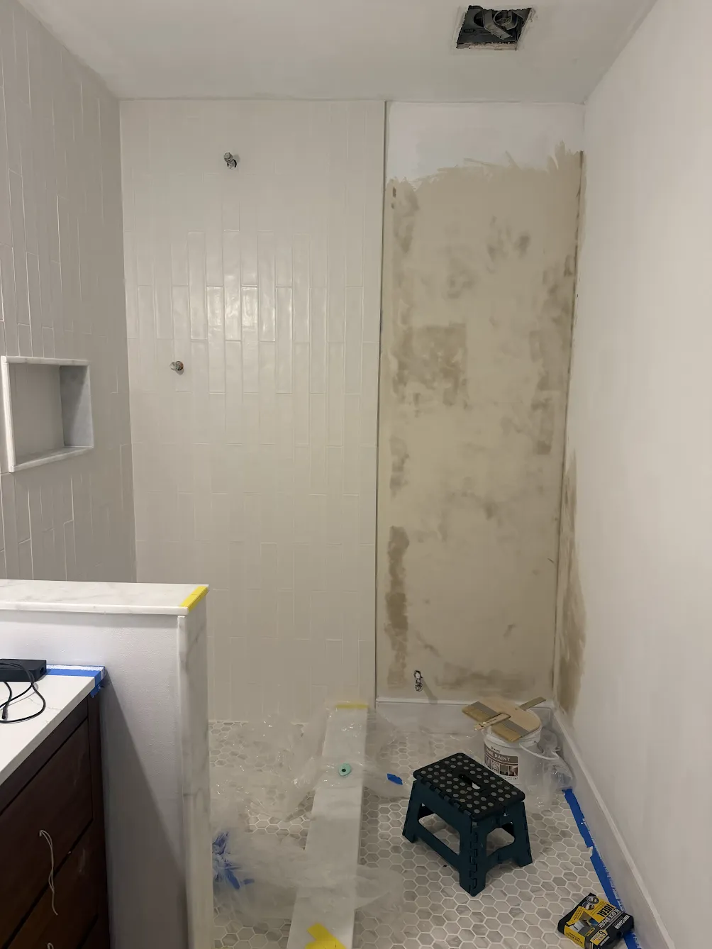 First coat of Vasari mineral paint going onto the bathroom wall
